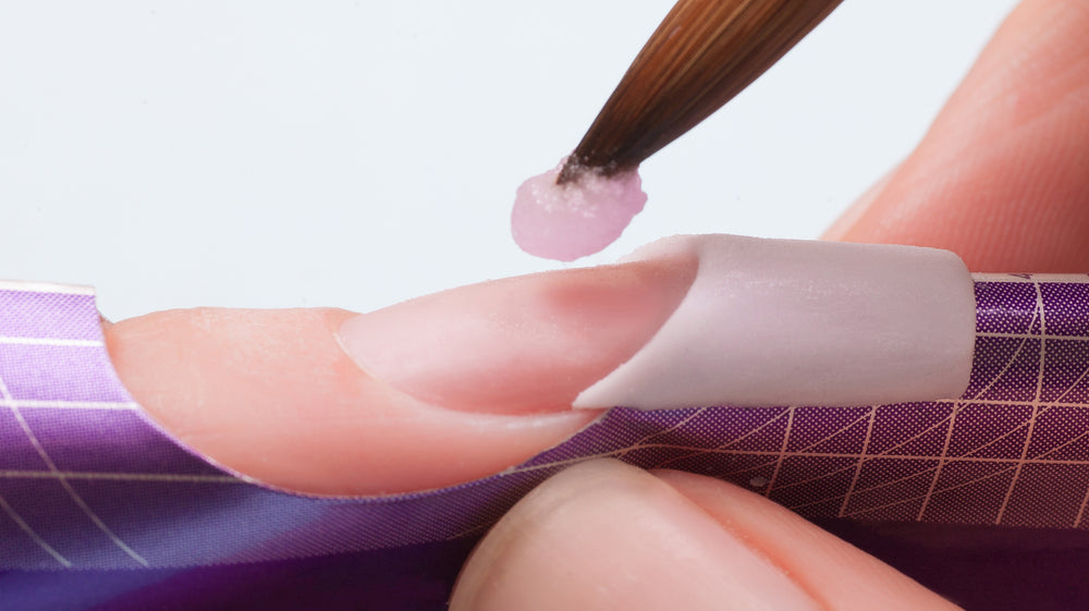 Placing a bead of pink acrylic